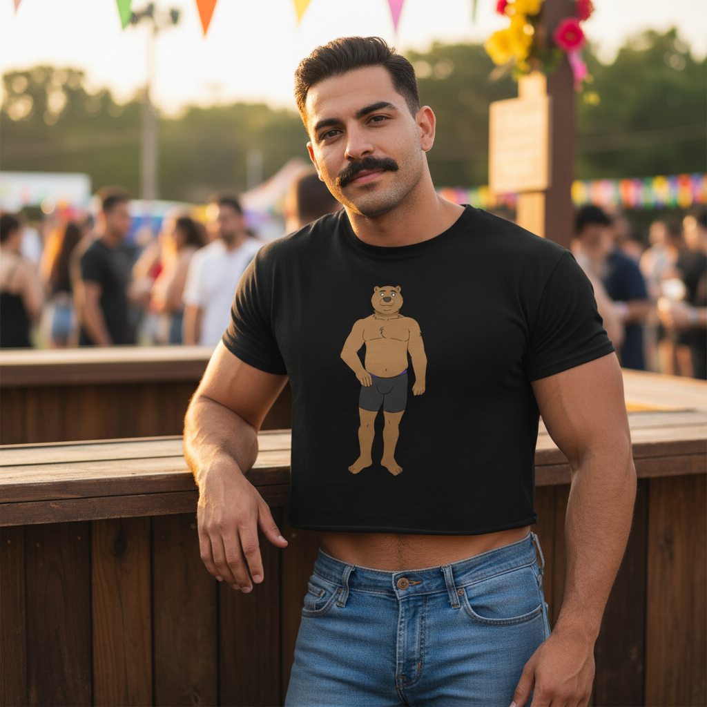 Person wearing a black cropped T-shirt with a cartoon bear graphic at an outdoor festival