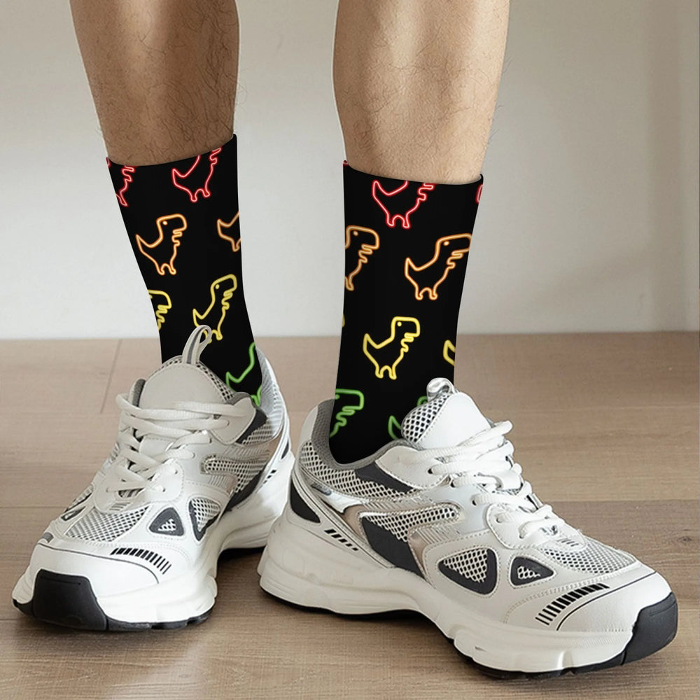 Black crew socks with colorful dinosaur outlines, worn with white sneakers