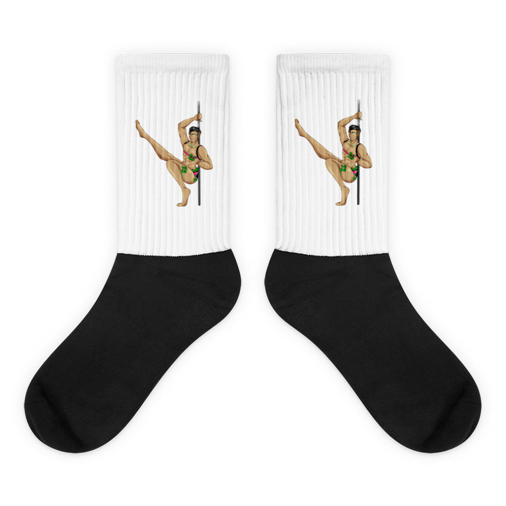 Pair of crew socks with black feet and white ribbed cuffs showing a pole dancer in a green floral outfit