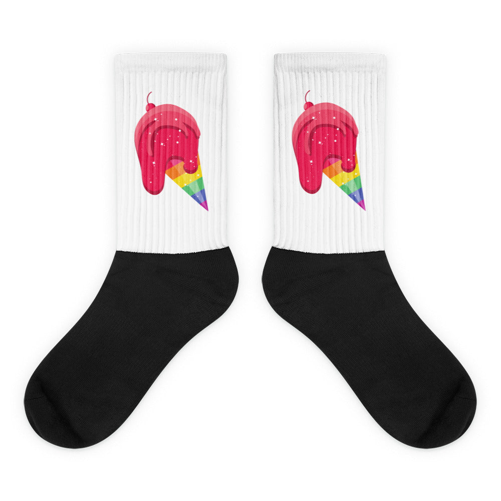 Pair of white ribbed socks with black feet and pink ice cream cones with rainbow stripes
