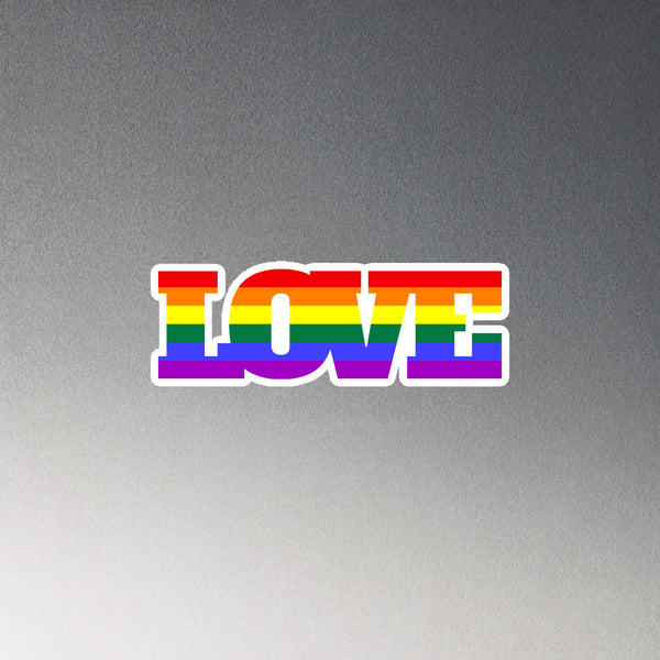 Rainbow-striped LOVE magnet on a gray background