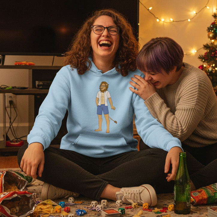 Person wearing a light blue hoodie with a cartoon lion-tailed figure, laughing beside a friend