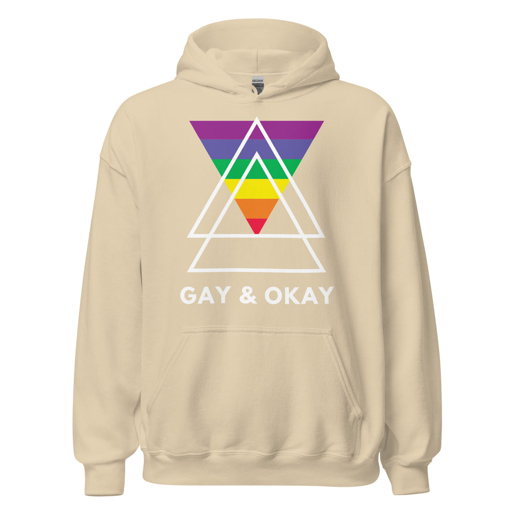 Beige unisex hoodie with bold white "GAY & OK" text under white triangles layered with rainbow stripes, queer pride vibes.