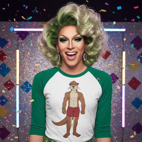 Front-facing person models a white raglan shirt with green sleeves and a cartoon otter in red shorts
