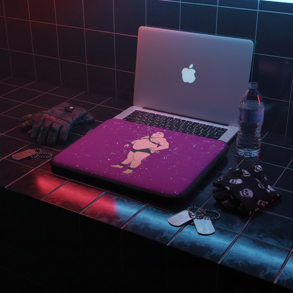 Purple laptop sleeve with a cartoon pig in black underwear, shown in front of an open laptop