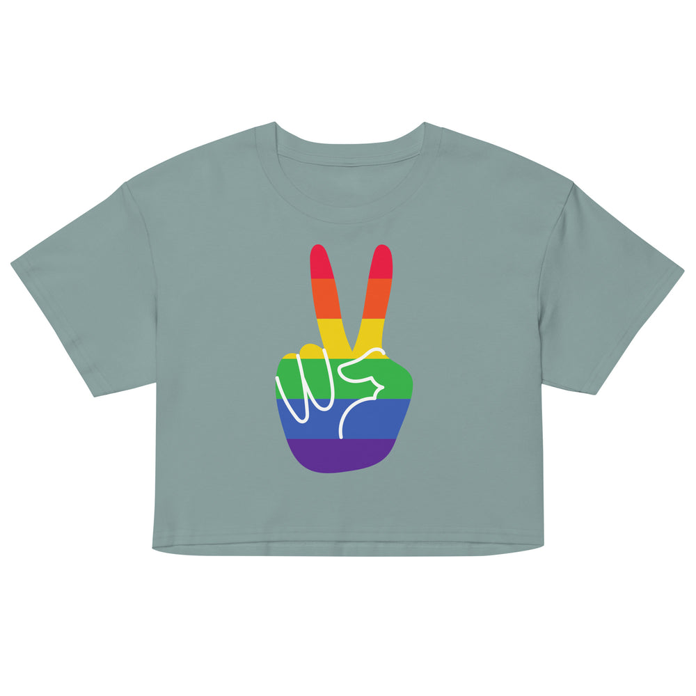 Front-view sage green crop top with a rainbow-striped peace-sign hand graphic