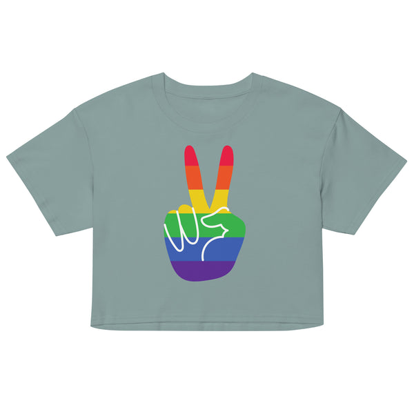 Front-view sage green crop top with a rainbow-striped peace-sign hand graphic