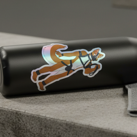 Black cylindrical tumbler on a gray surface, decked with a playful fox vinyl sticker, gray straps