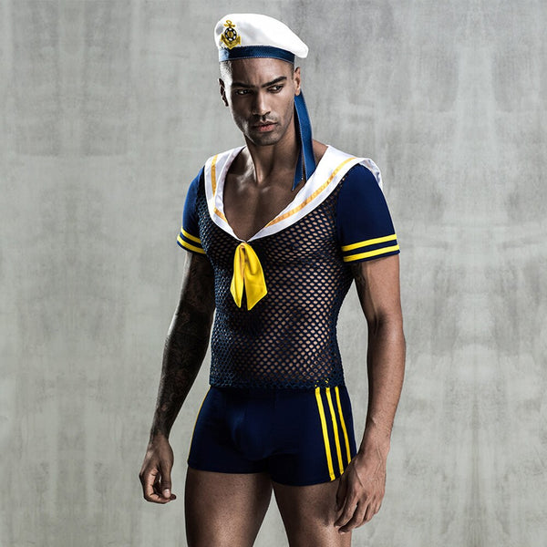 Model wearing a navy, yellow, and white sailor costume with a mesh top and shorts