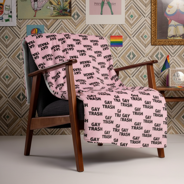 Gay Trash Throw Blanket with bold black “GAY TRASH” lettering