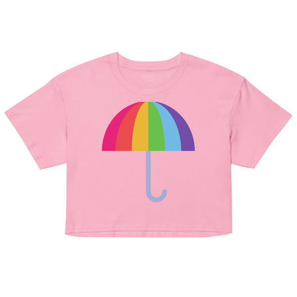 Front view of a pink crop top with a rainbow umbrella graphic and curved blue handle