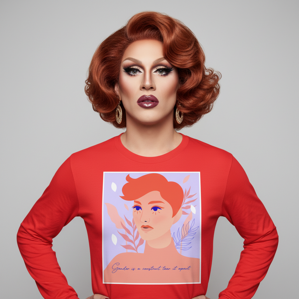 Unisex long sleeve tee with “Gender is a construct, tear it apart” slogan, modeled by bold red-haired person in glam makeup
