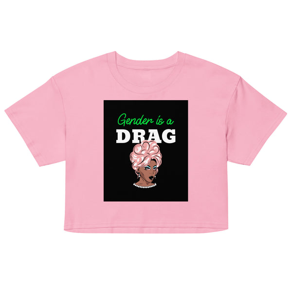 Pink crop top with black graphic reading “Gender is a DRAG” and a glam drag portrait
