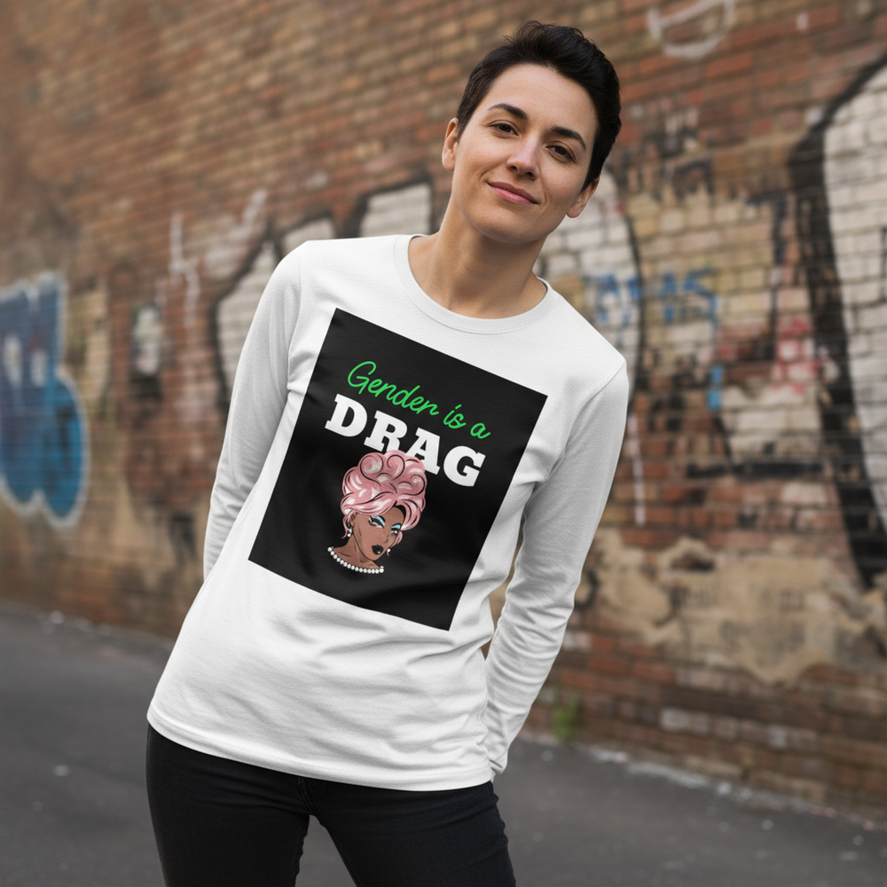 Unisex long sleeve tee shows pink-haired drag queen and slogan "Gender is a DRAG"; worn by short-haired queer babe