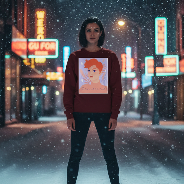 Model in a burgundy sweatshirt with a red-haired illustrated face, standing in snowy neon-lit streets