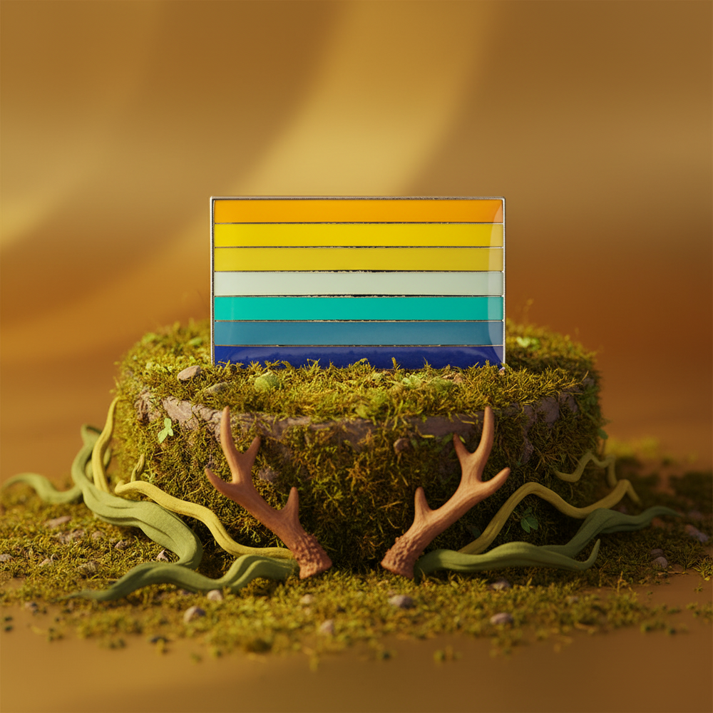 Genderfaun pride flag enamel pin displayed upright on moss with antler decorations