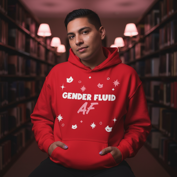 Person wearing a red hoodie reading “GENDER FLUID AF” with cat and sparkle graphics