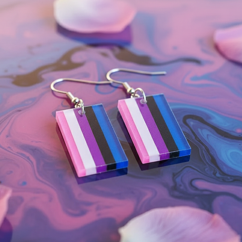 Pair of striped genderfluid pride acrylic dangle earrings on a marbled pink-and-blue surface