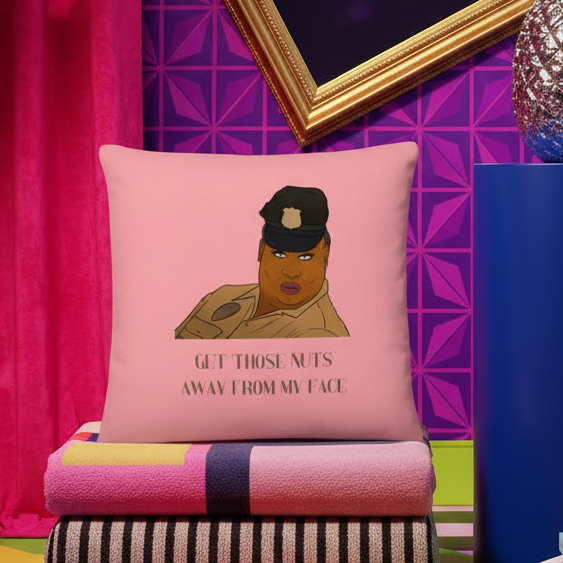 Pink "Get Those Nuts Away From My Face! (Latrice Royale)" LGBT pillow with cartoon stern police officer on folded striped