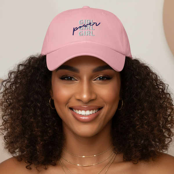 Girl Girl Girl Power Cap in pink embroidery, worn by a femme with curly hair, gold hoops, layered gold chains