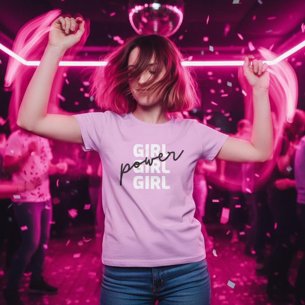 Light purple “Girl Girl Girl Power” T-shirt worn by a person dancing under pink neon, disco ball
