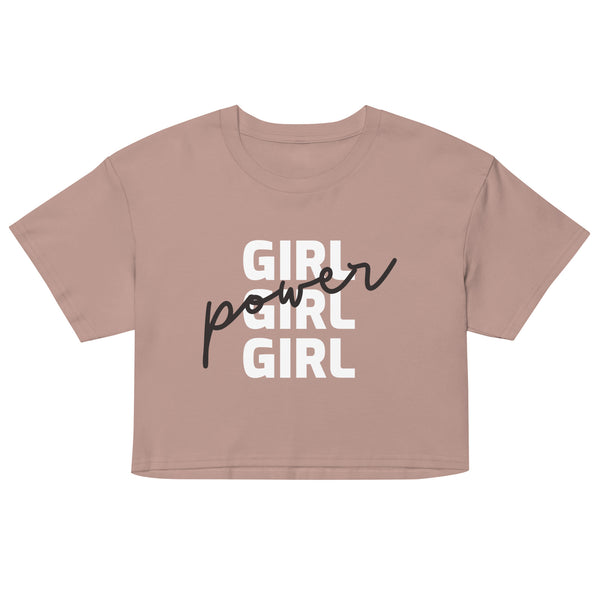 Front view of a dusty rose crop top reading “GIRL GIRL GIRL” in white and black script