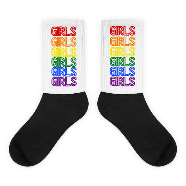 Pair of black-and-white socks with rainbow-colored GIRLS text on the cuffs