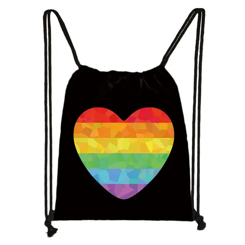 Black drawstring bag with a large rainbow-striped heart graphic