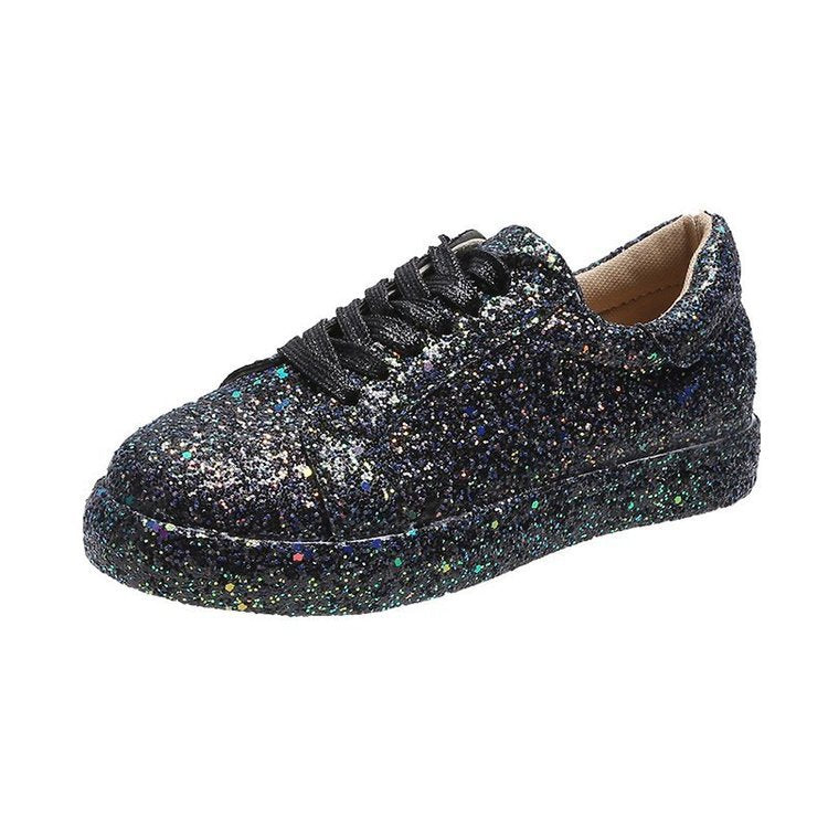 Single black glitter-covered lace-up sneaker shown from a front-side angle on white