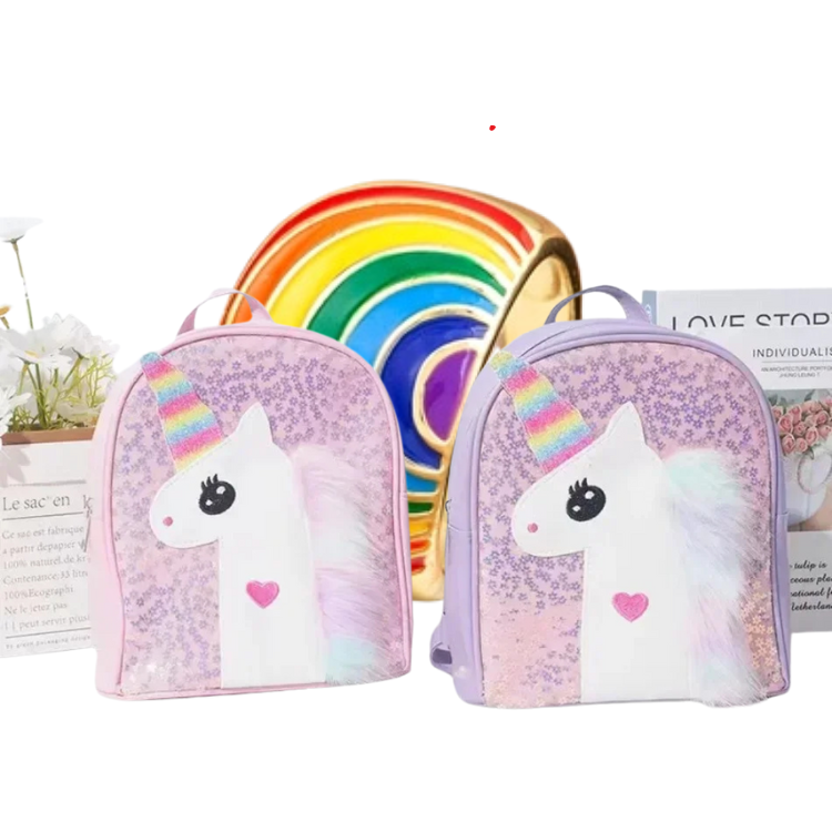 Glittery unicorn backpacks with rainbow horns, pastel faux-fur manes, and pink heart details