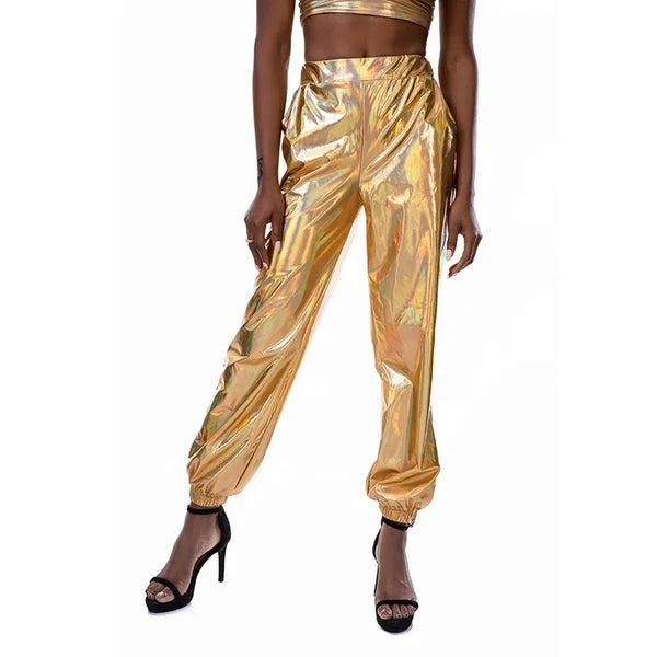 Model wearing metallic gold high-waisted jogger pants with elastic cuffs and black heels