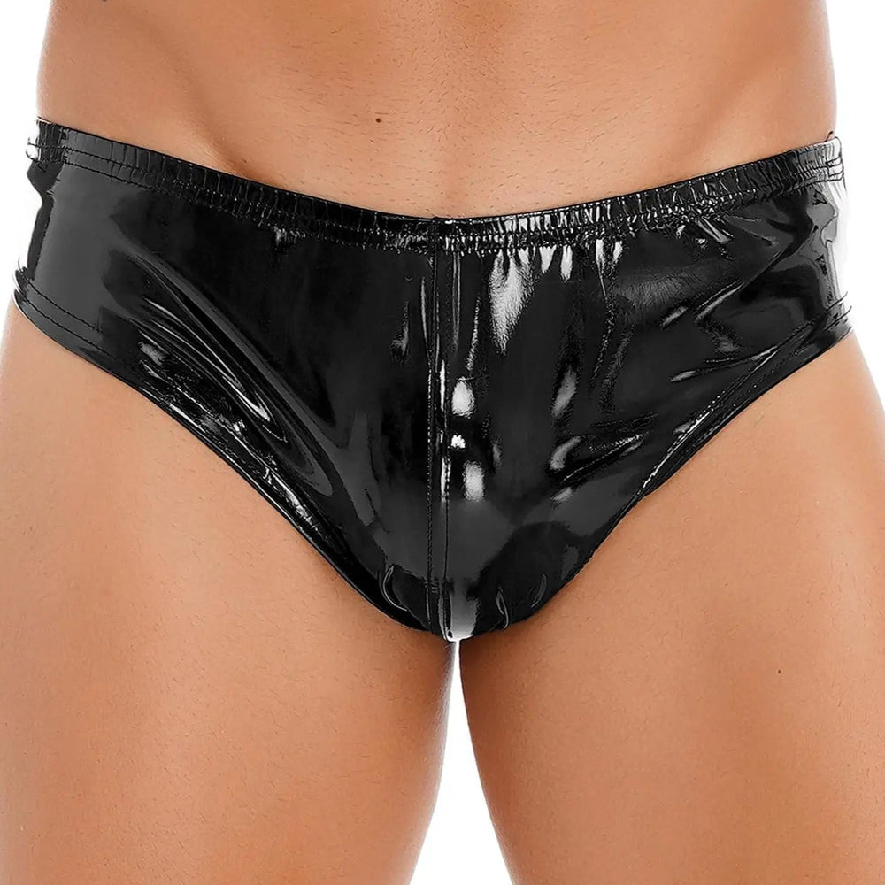 Front close-up of a model wearing glossy black vinyl briefs with an elastic waistband