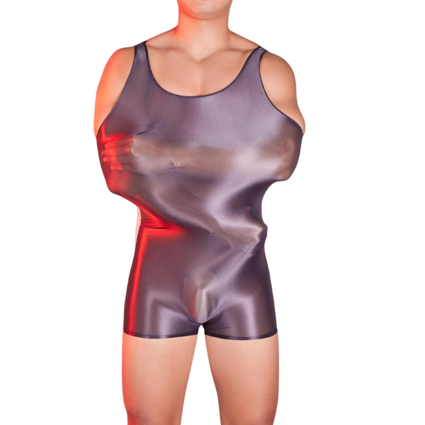Front view of a model wearing a glossy, semi-transparent dark bodysuit with shorts-length legs