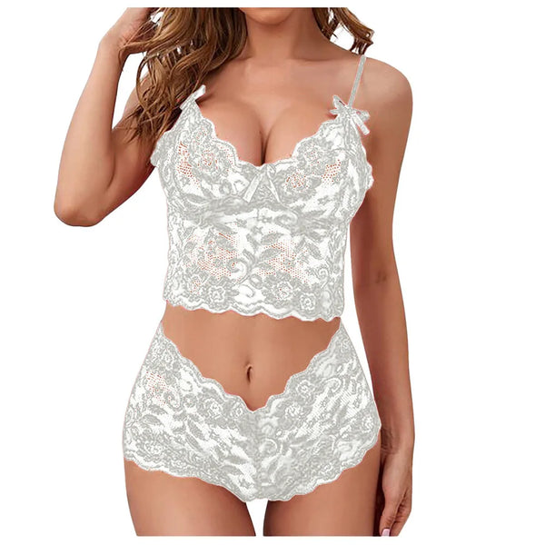 Front view of a model wearing a white lace camisole and matching high-waisted shorts