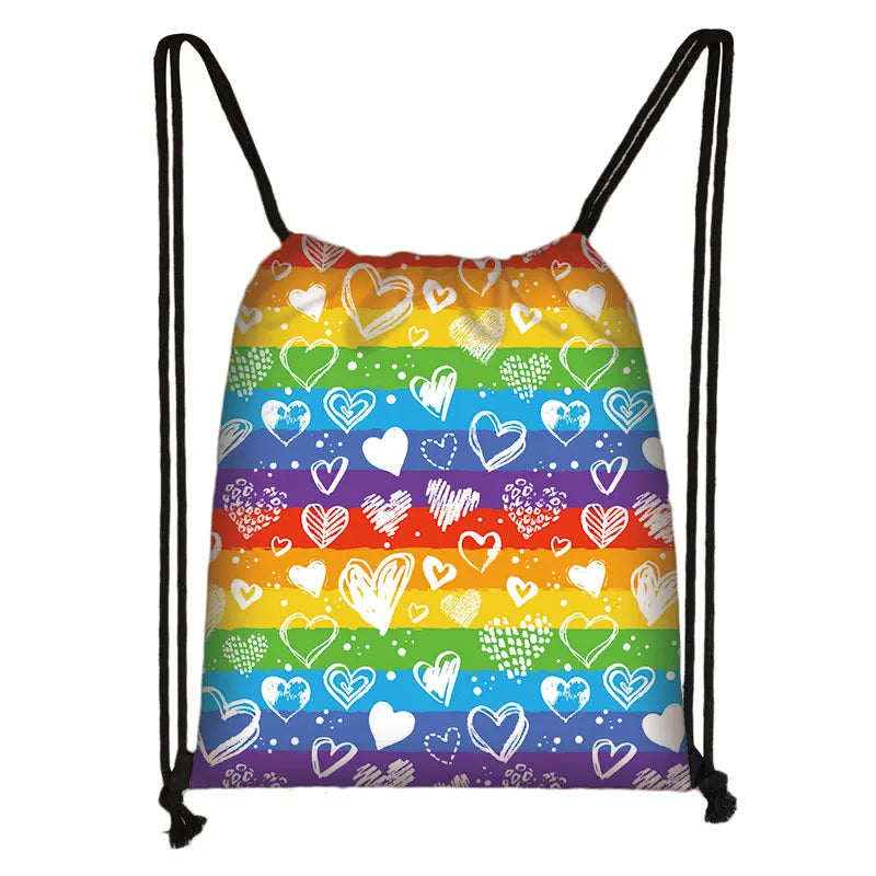 Rainbow-striped drawstring bag covered in white and multicolored heart doodles