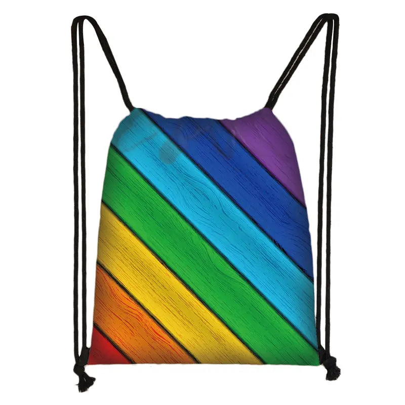 Drawstring bag with diagonal rainbow stripes in red, orange, yellow, green, blue, and purple