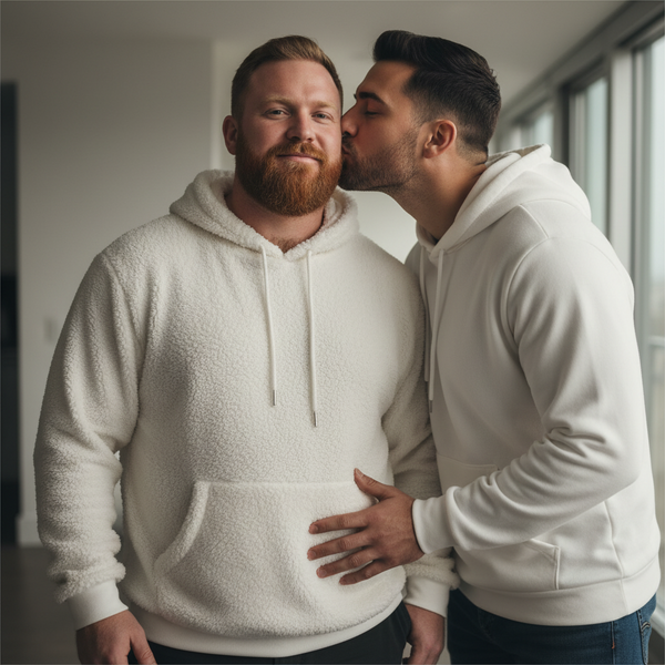 Gay bear fleece hoodie worn by a bearded man as his partner kisses him
