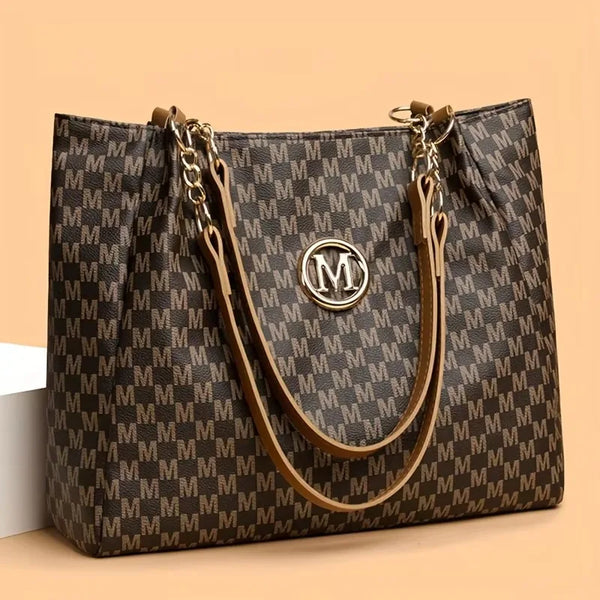 Structured brown M-monogram tote with tan straps, gold chain accents, and round M emblem