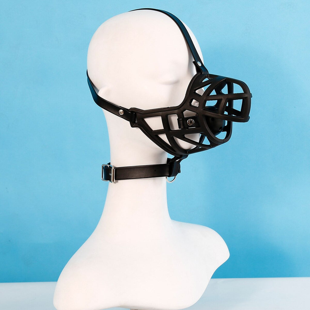 Black leather half-face bondage mask with cage-like muzzle on a white mannequin, side view
