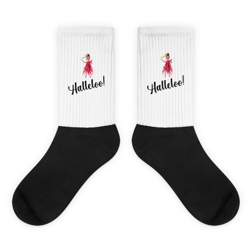 Pair of black-and-white ribbed socks with red-dressed figure and “Halleloo!” text