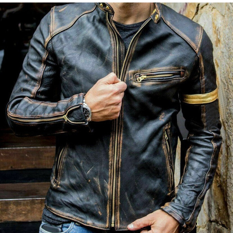 Close-up model wearing a distressed black biker jacket with gold arm stripe and zippers