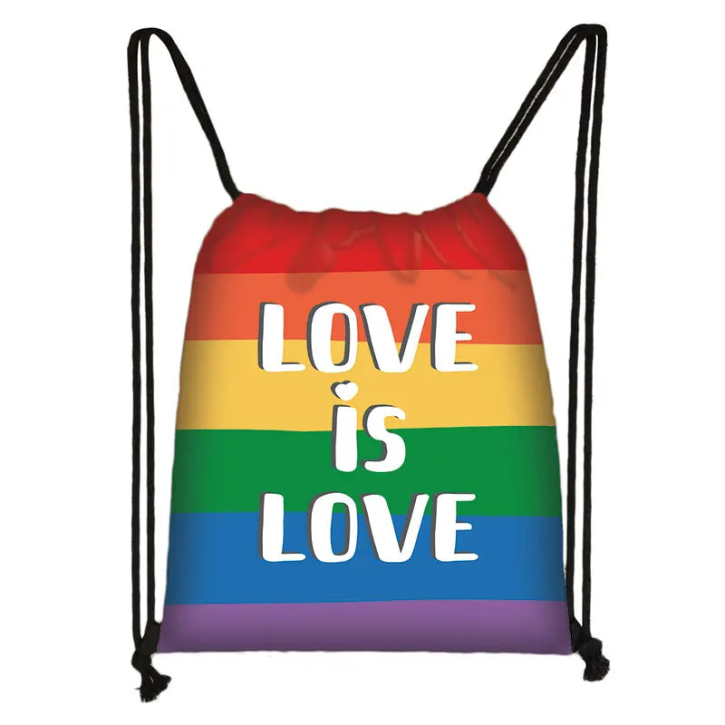 Rainbow Pride drawstring bag with white “LOVE IS LOVE” lettering