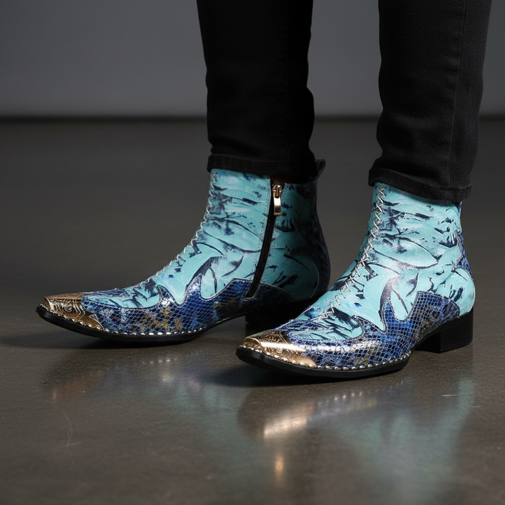 Close view of blue patterned ankle boots with metallic gold toes and block heels on a model