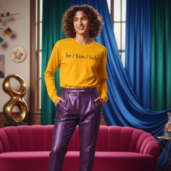 He / Him / Hole Unisex Long Sleeve T-Shirt on a person in shiny purple pants, with pink sofa, blue curtains, art behind