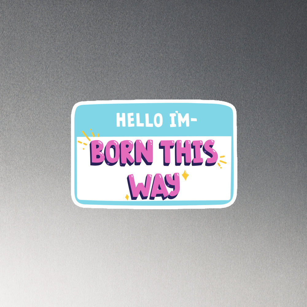 Magnetic vinyl name tag in blue and white with bold purple and pink “HELLO IM BORN THIS WAY” text