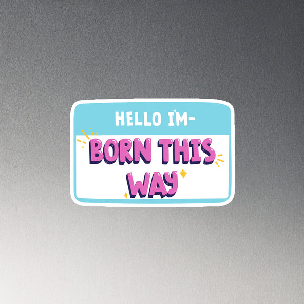 Magnetic vinyl name tag in blue and white with bold purple and pink “HELLO IM BORN THIS WAY” text