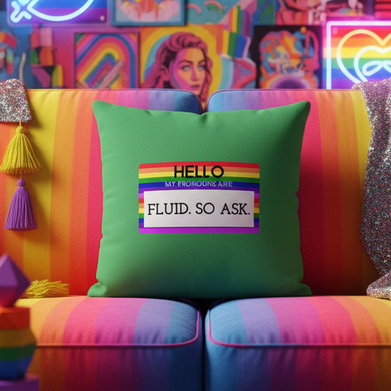 Hello My Pronouns Are Fluid. So Ask. pillow with a rainbow-patterned label on a rainbow-striped couch