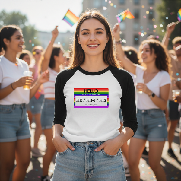 Hello My Pronouns Are they / them / their 3/4 sleeve raglan shirt on a happy person at Pride, with pride flags and confetti
