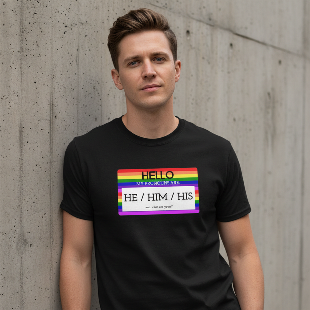 They/them/their pronouns tee with rainbow-striped "Hello My Pronouns Are He / Him / His" label