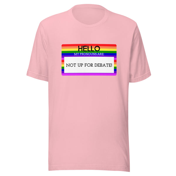 Light pink T-shirt with rainbow-striped name-tag graphic and bold text: HELLO MY PRONOUNS ARE: NOT UP FOR DEBATE!